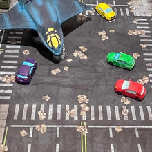 Load image into Gallery viewer, 3’x3’ gaming mat with a Intersection city streets blocks theme, marketed for tabletop gaming, accompanied by a black canvas zipper bag TableWar neoprene Marvel Tournament Tabletop Game mat
