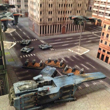 Load image into Gallery viewer, 4’x4’ gaming mat with a Urban City theme, marketed for tabletop gaming, accompanied by a black canvas zipper bag TableWar neoprene Tournament Tabletop Game mat