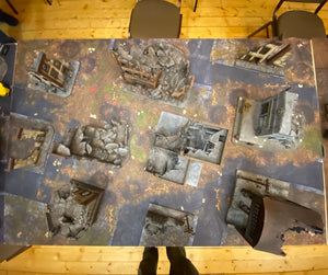 60x44 inch gaming mat with a Ruined city Urban theme, marketed for tabletop gaming, a black canvas zipper bag included. A TableWar neoprene Tournament Tabletop warhammer Game Battle mat 
