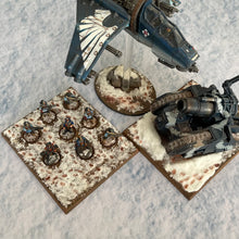 Load image into Gallery viewer, ‘Snow’ design shown with miniatures for scale purposes 30”x22”’ gaming mat with a Snow winter theme, marketed for tabletop gaming, accompanied by a black canvas zipper bag TableWar neoprene KillTeam Tournament Tabletop Game mat 
