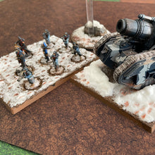 Load image into Gallery viewer, ‘Cracked Earth’ design shown with miniatures on our gaming mat with a cracked earth theme, marketed for tabletop gaming, accompanied by a black canvas zipper bag TableWar neoprene Tournament Tabletop Game mat 
